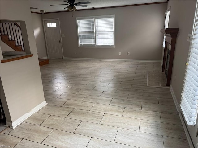 700 Rapidan River Ct Unit D, Chesapeake, VA 23320 - unfurnished living room featuring ceiling fan, a fireplace, stairs, baseboards, and ornamental molding