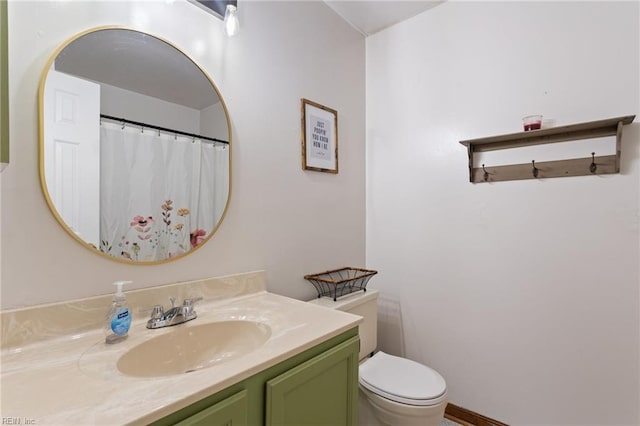 full bath featuring vanity and toilet