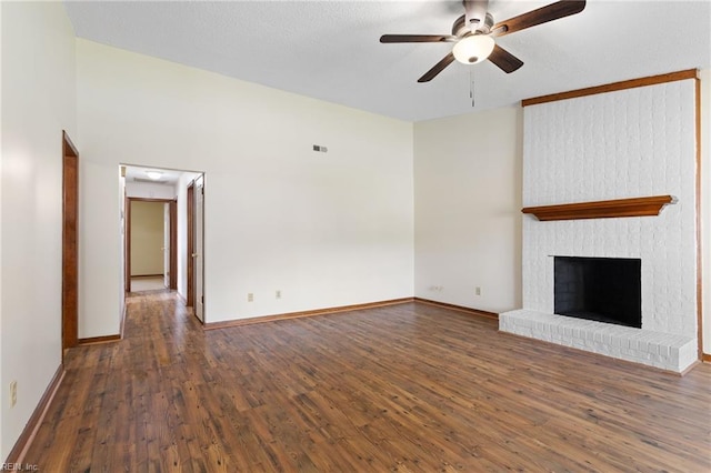 unfurnished living room featuring baseboards, ceiling fan, and wood finished floors