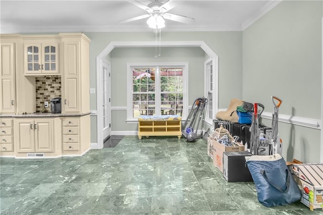 dining space featuring crown molding, baseboards, a ceiling fan, and visible vents
