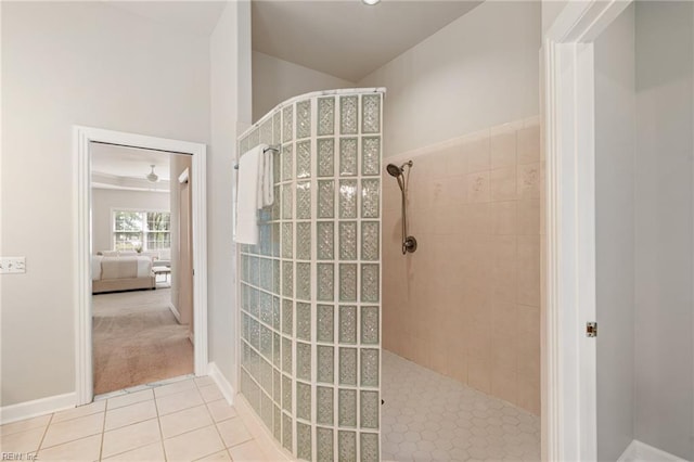 ensuite bathroom with tile patterned floors, a walk in shower, ensuite bath, and vaulted ceiling