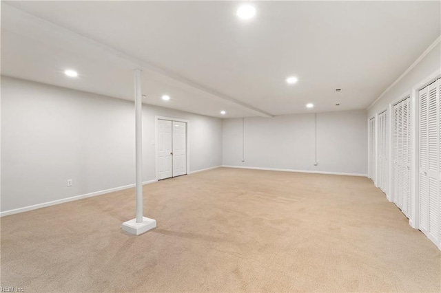 finished basement with recessed lighting, baseboards, and light colored carpet