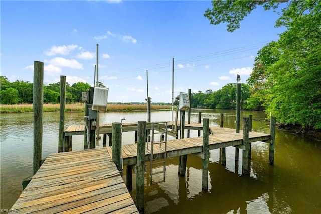 view of dock with a water view and boat lift