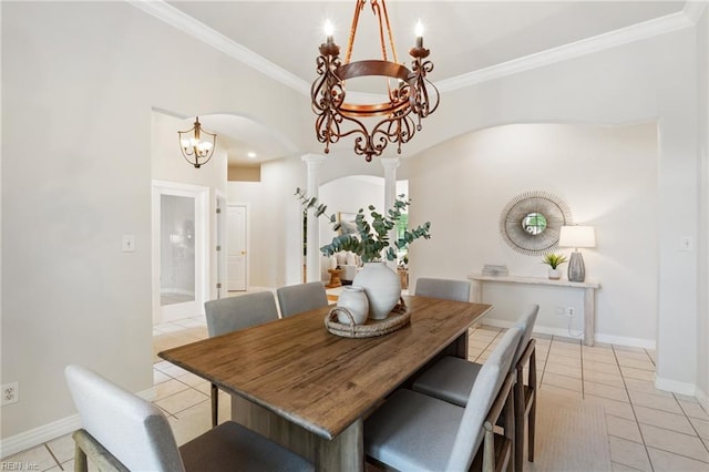 dining area featuring arched walkways, a notable chandelier, ornamental molding, and light tile patterned floors