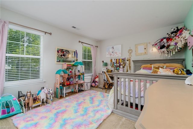 carpeted bedroom with visible vents