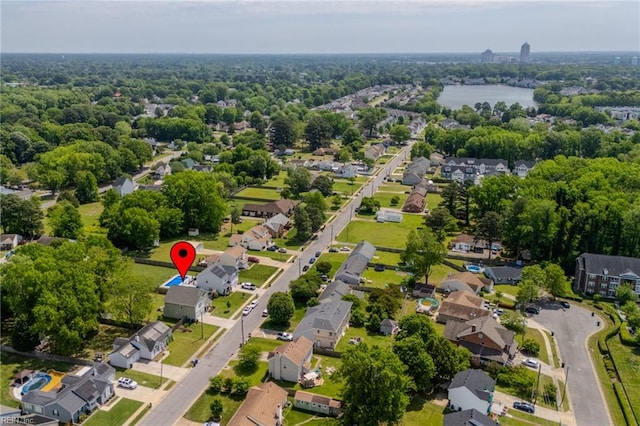 drone / aerial view with a water view and a residential view