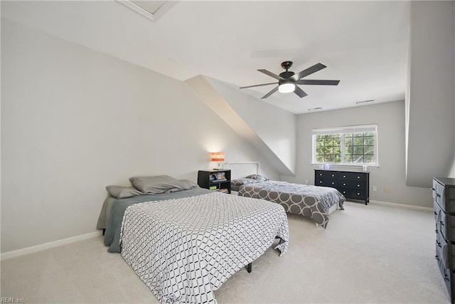 bedroom featuring light colored carpet, a ceiling fan, baseboards, and visible vents