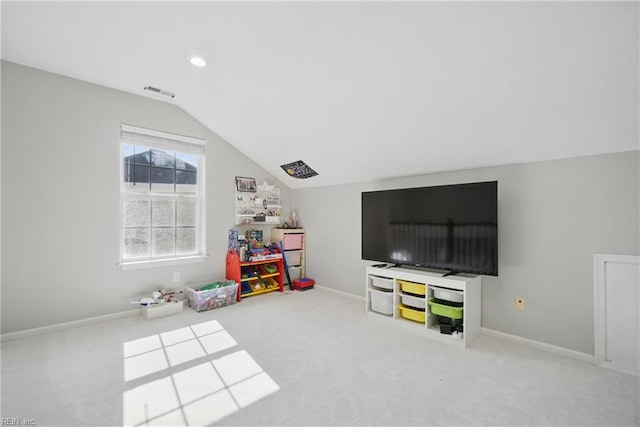 game room with visible vents, carpet, and vaulted ceiling