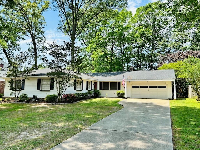 single story home with an attached garage, driveway, and a front yard
