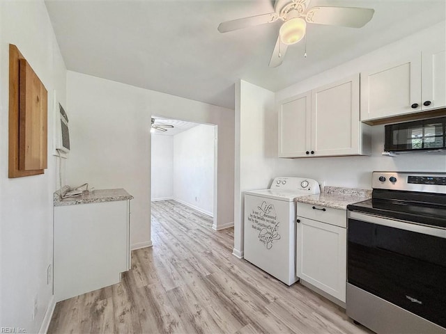kitchen with ceiling fan, washer / clothes dryer, black microwave, stainless steel range with electric cooktop, and white cabinetry