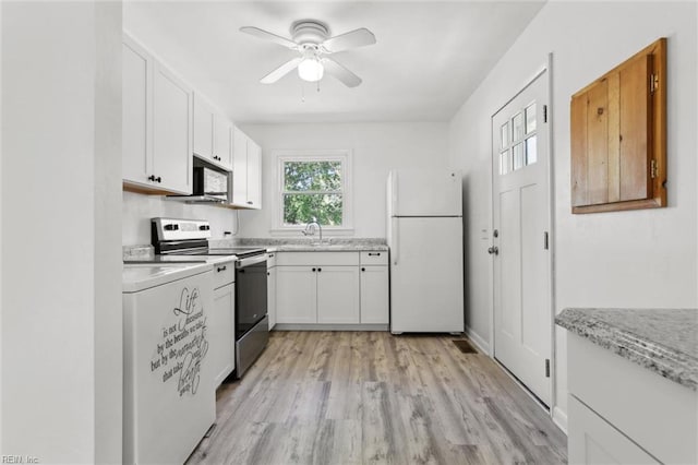 kitchen with freestanding refrigerator, ceiling fan, white cabinets, and stainless steel electric range oven