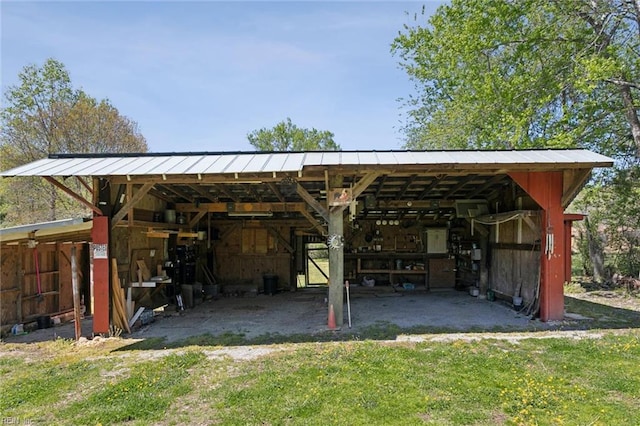 view of parking featuring a pole building and a detached carport