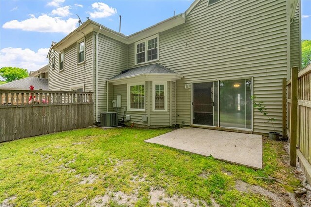 back of property featuring a patio, a lawn, and fence