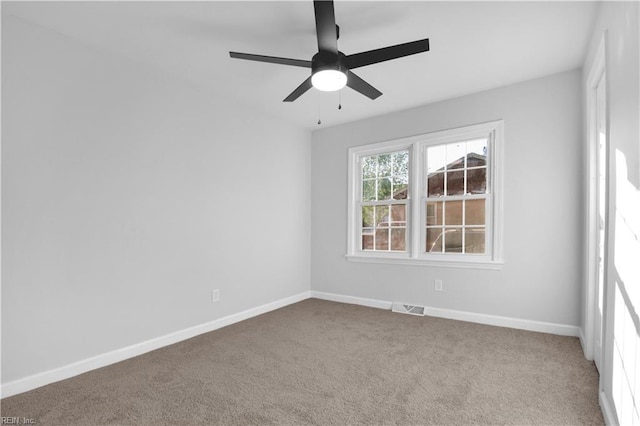 unfurnished room featuring baseboards, ceiling fan, carpet flooring, and visible vents