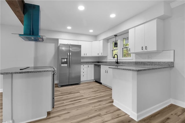 kitchen featuring exhaust hood, a sink, dishwasher, light wood-style flooring, and stainless steel refrigerator with ice dispenser