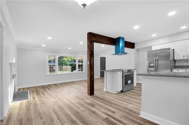 kitchen featuring crown molding, baseboards, white cabinets, stainless steel appliances, and extractor fan