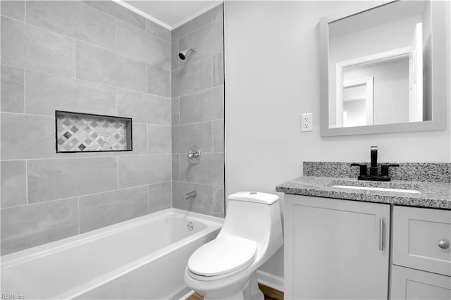 full bathroom featuring vanity, washtub / shower combination, and toilet