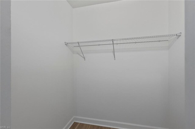 2830 Shore Dr Unit 405, Virginia Beach, VA 23451 - walk in closet featuring dark wood-style flooring