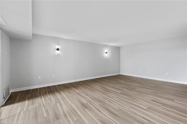 2830 Shore Dr Unit 405, Virginia Beach, VA 23451 - unfurnished living room featuring visible vents, light wood-style floors, and baseboards