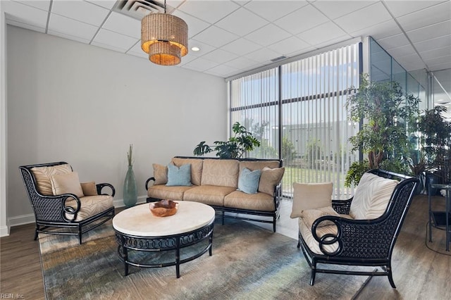 2830 Shore Dr Unit 405, Virginia Beach, VA 23451 - living room with visible vents, wood finished floors, a wall of windows, baseboards, and a paneled ceiling