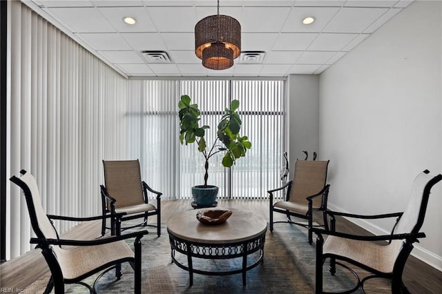 2830 Shore Dr Unit 405, Virginia Beach, VA 23451 - living area featuring baseboards, a wall of windows, wood finished floors, and visible vents