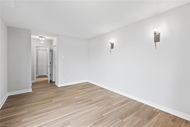 2830 Shore Dr Unit 405, Virginia Beach, VA 23451 - spare room featuring baseboards and light wood-style flooring