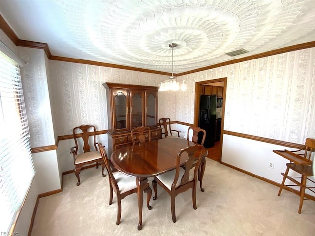 dining space featuring visible vents, crown molding, light carpet, and wallpapered walls