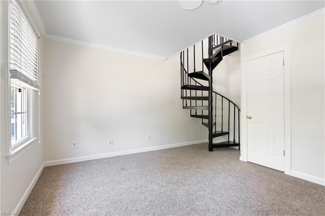 unfurnished living room featuring carpet flooring, baseboards, plenty of natural light, and ornamental molding