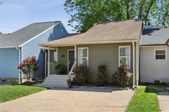 view of front facade with a shingled roof