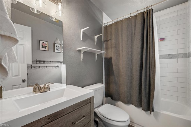 full bathroom featuring vanity, toilet, a textured wall, and shower / bath combo with shower curtain