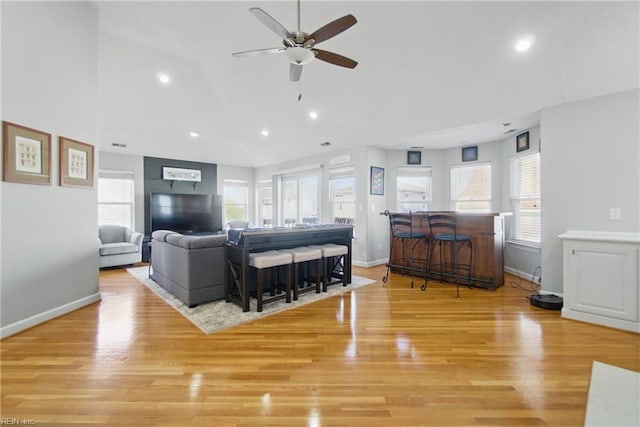 828 Vanderbilt Ave, Virginia Beach, VA 23451 - living room featuring ceiling fan, recessed lighting, baseboards, light wood-type flooring, and vaulted ceiling