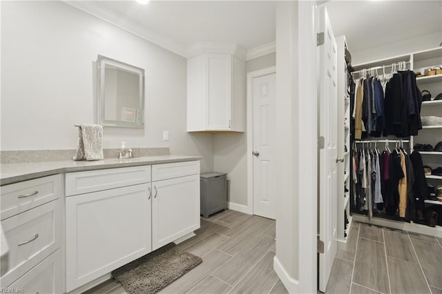 828 Vanderbilt Ave, Virginia Beach, VA 23451 - interior space with crown molding, wood finish floors, a sink, and baseboards