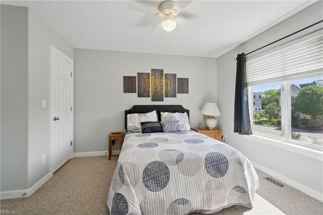 828 Vanderbilt Ave, Virginia Beach, VA 23451 - bedroom with baseboards, a ceiling fan, and light carpet