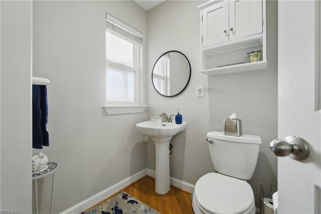 828 Vanderbilt Ave, Virginia Beach, VA 23451 - bathroom featuring baseboards, a sink, wood finished floors, and toilet