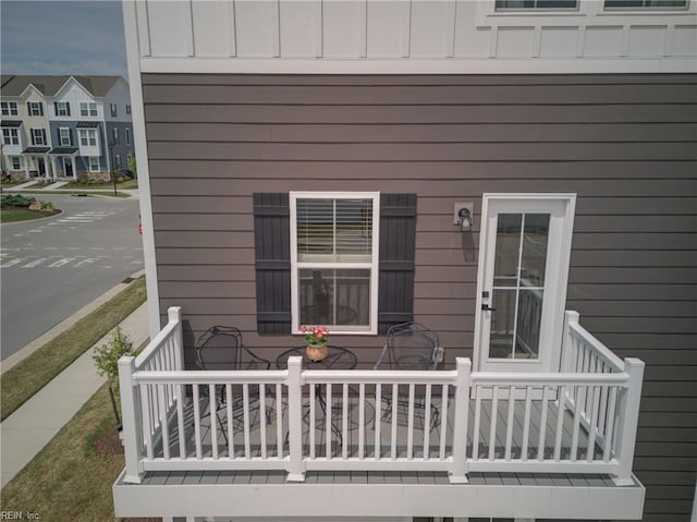 property entrance with a porch and a residential view