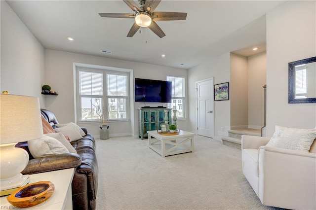 carpeted living area featuring recessed lighting, ceiling fan, visible vents, and baseboards