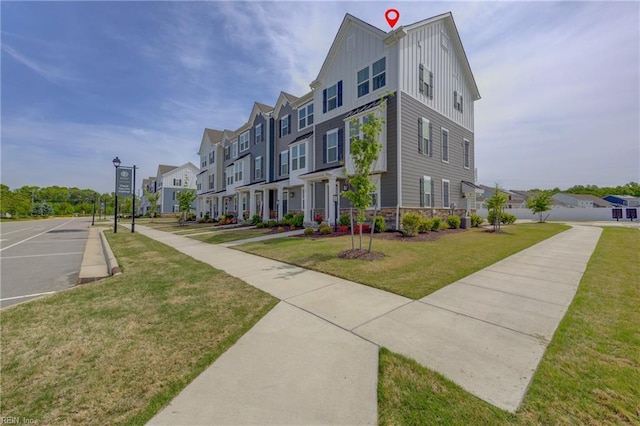 exterior space with a yard and a residential view