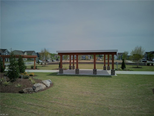 view of property's community featuring a gazebo and a lawn