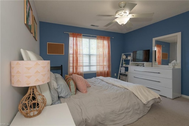 bedroom featuring baseboards, carpet, a ceiling fan, and visible vents