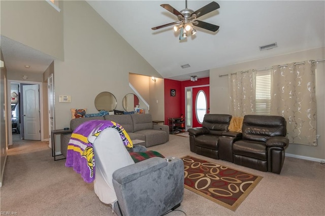 living room with ceiling fan, visible vents, high vaulted ceiling, baseboards, and carpet