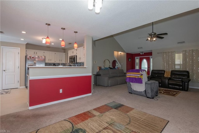 living area with baseboards, ceiling fan, light carpet, and recessed lighting