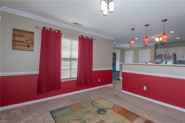 kitchen with visible vents, hanging light fixtures, stainless steel fridge, carpet flooring, and recessed lighting