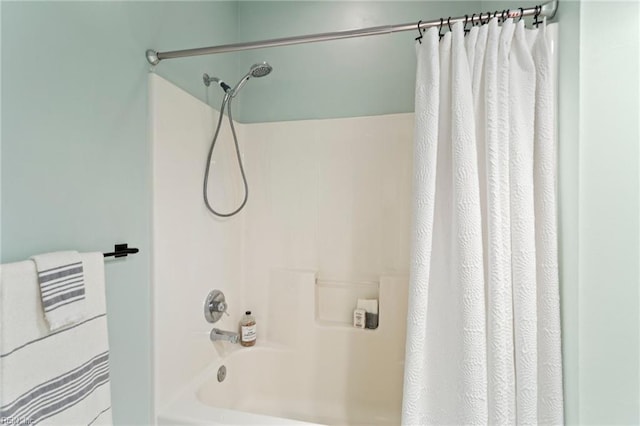 bathroom with shower / bath combo