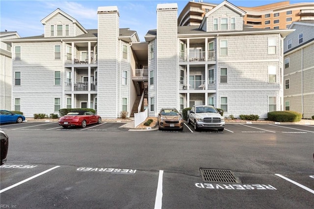 view of property featuring uncovered parking