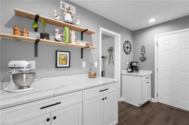 kitchen featuring visible vents, open shelves, dark wood finished floors, and white cabinetry