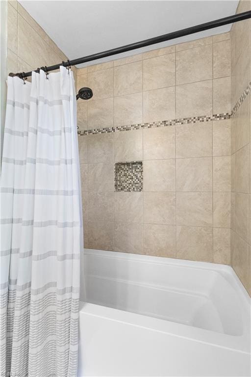 full bathroom with shower / bath combo