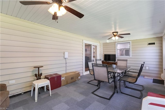 view of patio featuring outdoor dining space and ceiling fan