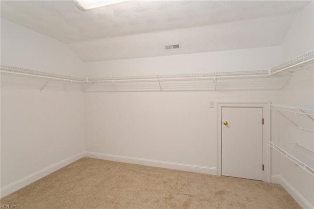 419 Hastings Pl, Suffolk, VA 23433 - walk in closet featuring visible vents, lofted ceiling, and light colored carpet