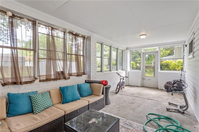 sunroom featuring an outdoor living space and ornamental molding