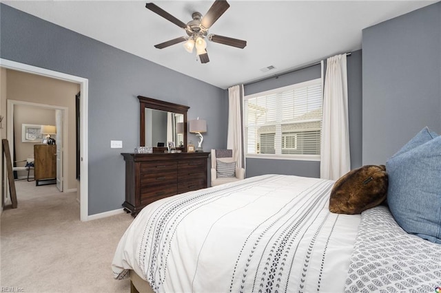 bedroom with baseboards, ceiling fan, visible vents, and light carpet